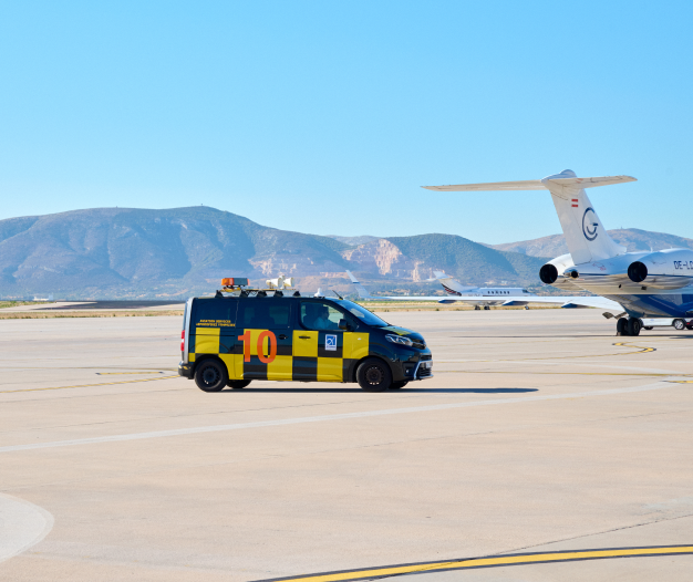 Small truck heading towards airplane