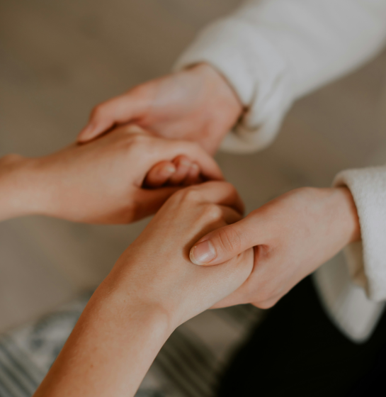 Two people holding hands