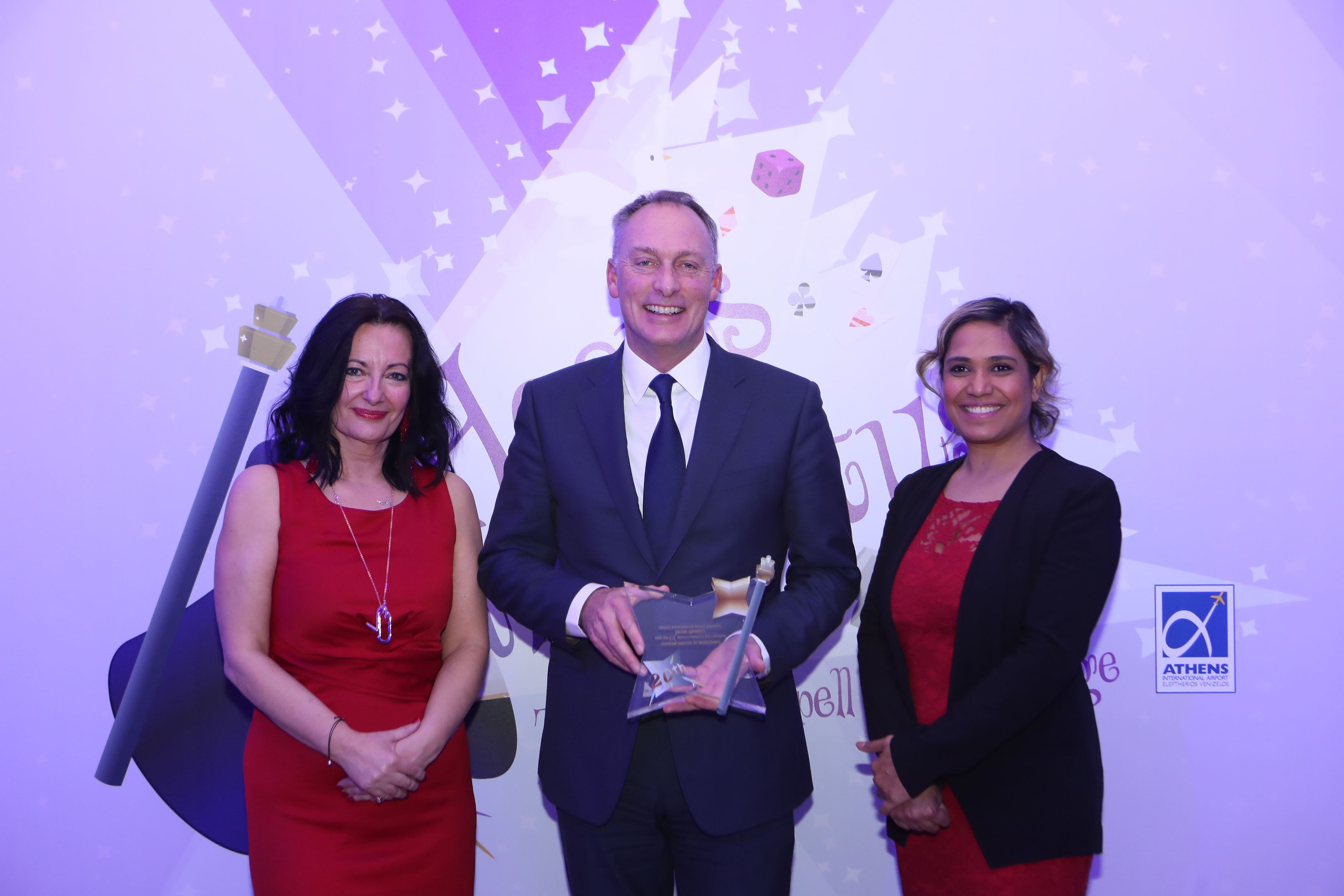 Group of people holding award