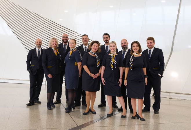 group photo of people working at the athens international airport