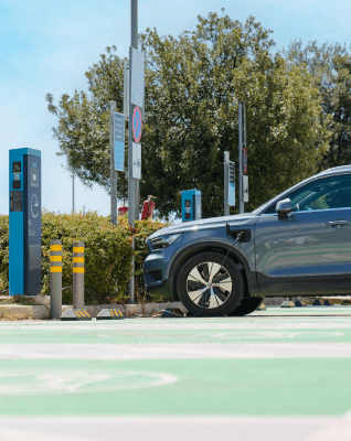 electric cars in front of a charger athens international airport