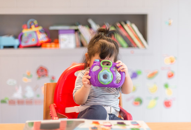 Child enjoying activities at the baby room in Athens International Airport