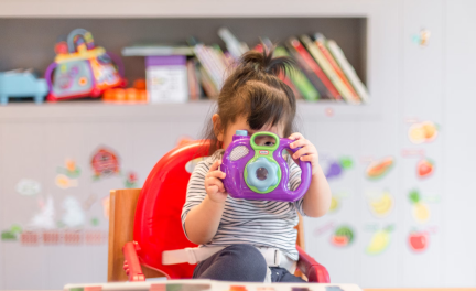 Child enjoying activities at the baby room in Athens International Airport